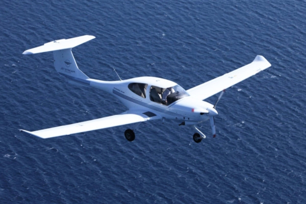 Airplane flying over sea
