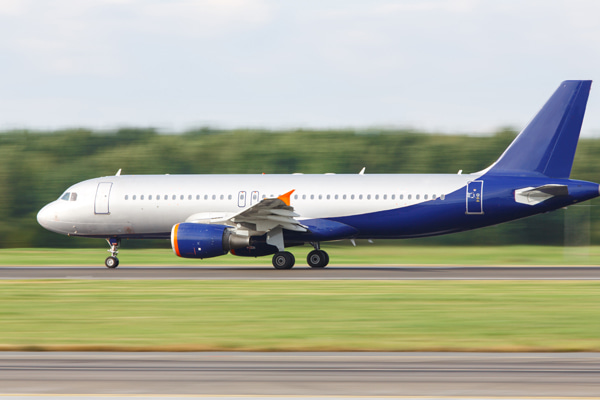 Passenger airplane moving on airport runway