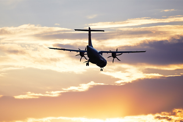 Aircraft against a dramatic sunset sky