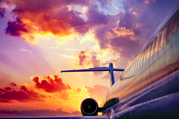 Passenger jet with a colorful sunset sky