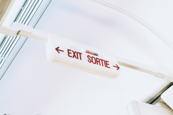 Exit sign inside an airplane cabin