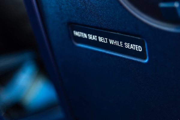 safety placard back of an airplane seat