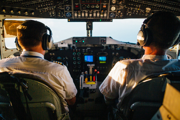 Pilots sitting in the cockpit of an aircraft