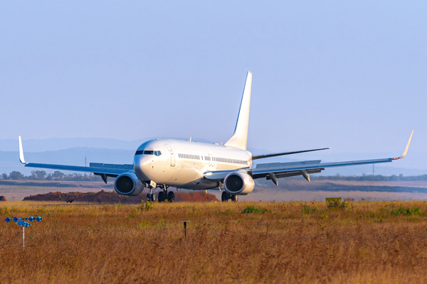 Passenger airplane taxiing on runway before takeoff